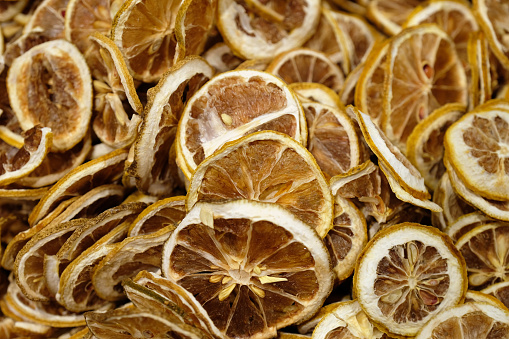 Fresh ripe lemon slices on wooden rustic background