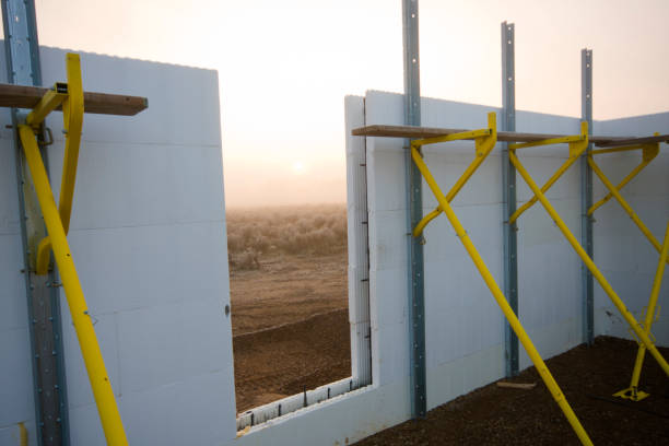 Opening In An ICF Wall An ICF (Insulated Concrete Form) wall with "Giraffe Brace" bracing and a doorway opening. concrete in formwork stock pictures, royalty-free photos & images