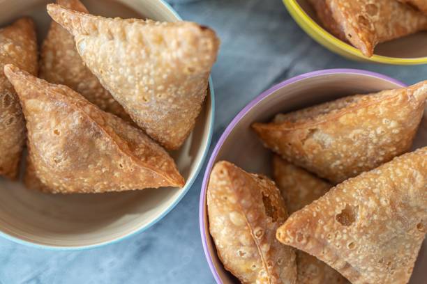 istock Deep fried Meat and Vegetable Samosa snacks ready to eat. 1395066890
