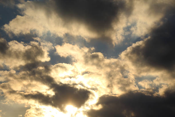 istock Sun behind the clouds at sunset 1395068163
