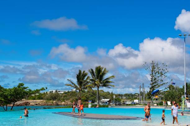Visitors enjoying a sunny day by the lagoon in Yeppoon, Queensland Australia stock photo