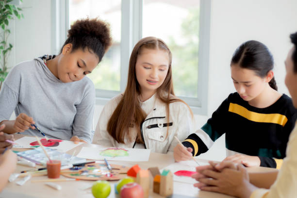Group of student sitting and studying and learning drawing with teacher together in classroom at the school, pupils creativity and development for drawing in course, back to school, education concept.