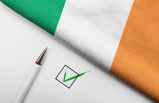 Pencil, Flag of Ireland and check mark on paper sheet