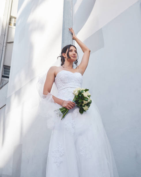 istock Shot of a beautiful bride standing outside 1395078491