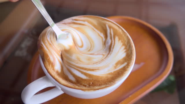 Stirring Hot Cappuccino In White Cup Slow Motion