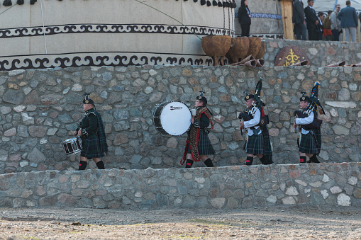 Isyk-Kul, Kyrgyzstan - September ‎29, ‎2018: Scottish musicians with drums and pipes during World Nomad Games
