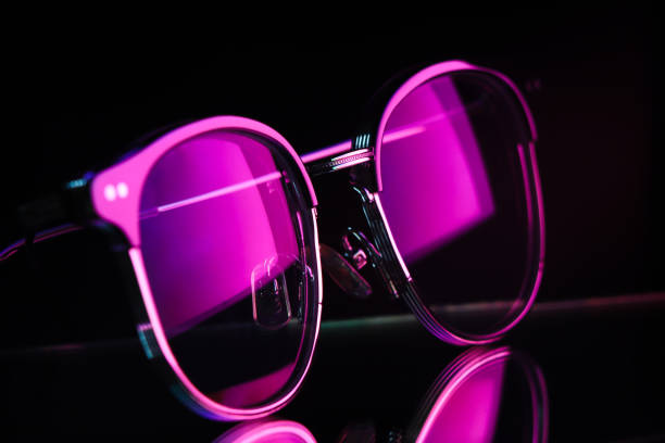 istock glasses with purple lighting and reflection 1395087748