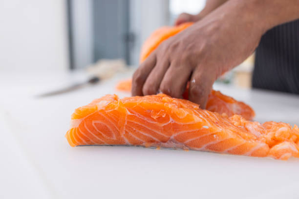 istock Fresh salmoon on cutting bord for cooking 1395087998