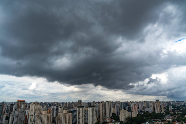 istock Dark and dramatic rain clouds over a city. 1395088635