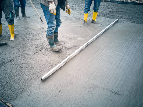istock Worker levels cement mortar 1395090199