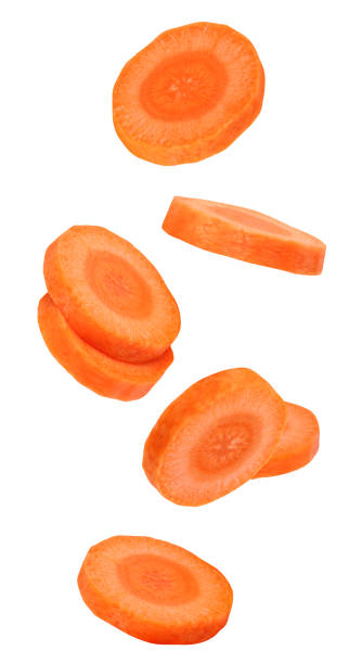 istock flying or falling pieces of carrots 1395091056
