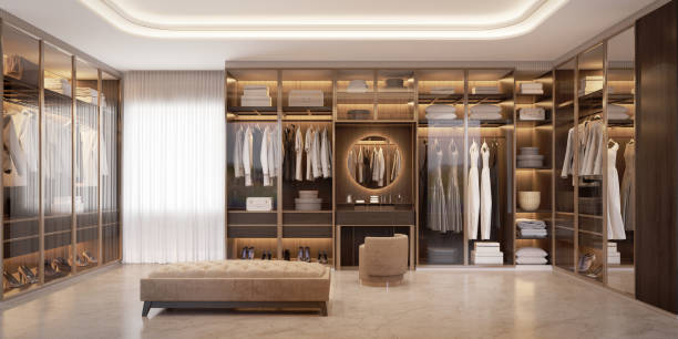 Panorama of luxury walk in closet interior with wood and gold elements.3d rendering stock photo