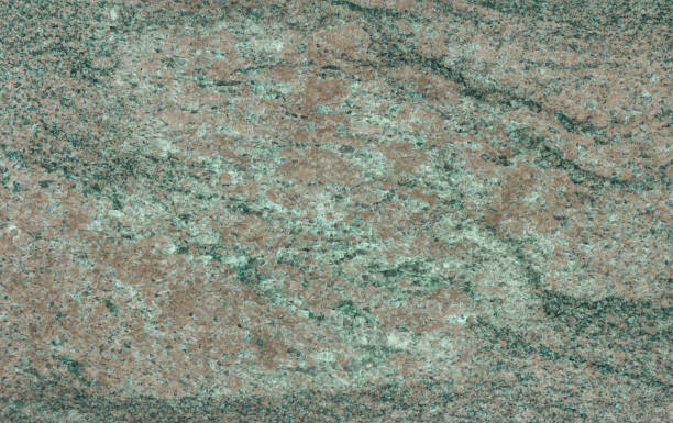 istock Granite is green. Minerals. Material for construction and design. Background. 1395094058