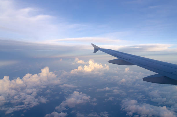 istock Aerial view over white puffy clouds horizon background. Beautiful sky and cloud texture view from airplane. 1395094096