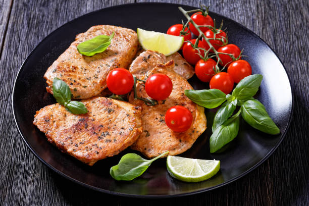 istock tomato basil pesto fried pork cutlets on plate 1395094889