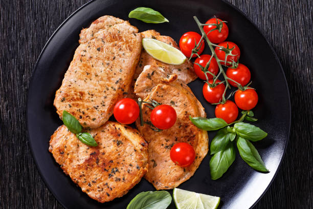 istock tomato basil pesto fried pork cutlets on plate 1395094947