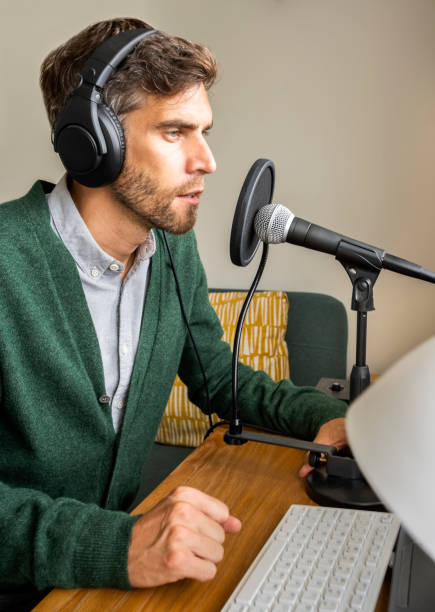 istock Man talking on the microphone on a podcast 1395095237