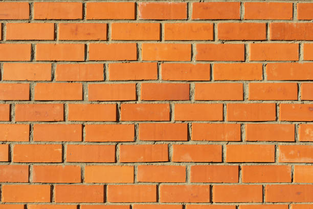 istock Wall is made of red brick. Stonework. Texture of wall. 1395095351
