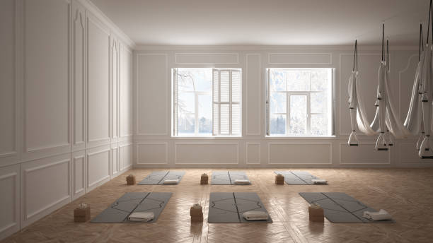istock Empty yoga studio interior design, minimal classic space, parquet floor, walls with stucco, mats and accessories, ready for yoga practice, meditation, panoramic window, winter view 1395097013