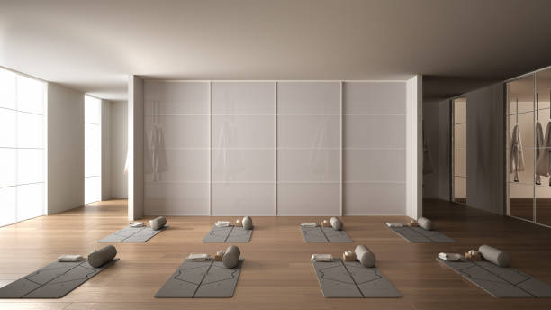 istock Empty yoga studio interior design, space with mats, hammocks, pillows and accessories, parquet, mirror, room divider and big panoramic window, ready for yoga practice, meditation 1395097022