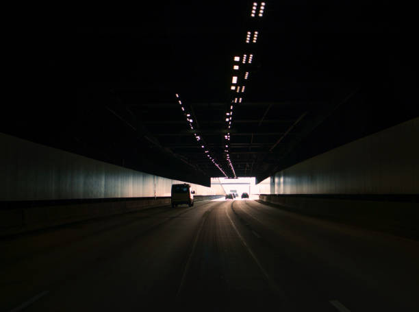 istock Exiting a road tunnel with traffic 1395097714