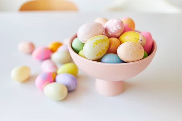 istock A pink bowl of brightly colored decorated Easter eggs 1395097909