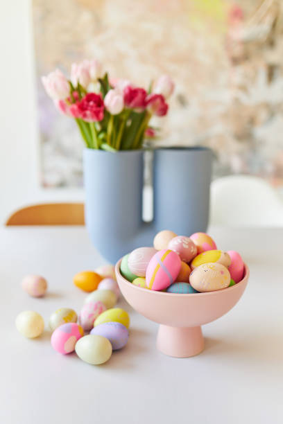 istock A pink bowl of brightly colored decorated Easter eggs 1395098018