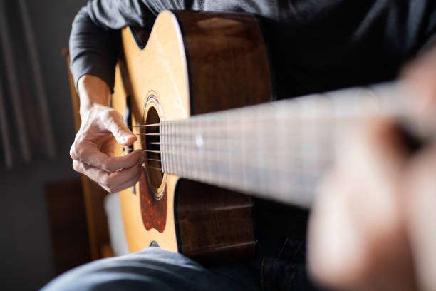 istock Acoustic guitar played by a man 1395098108
