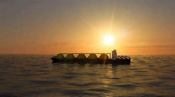 Photo of Floating regasification facility, regasification facility stationary in the sea. Sunset.