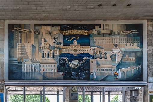 Mykolaiv, Ukraine - July 26, 2020: Abstract creative painting Mykolaiv on the wall inside Mykolaiv railway station. Artwork close-up