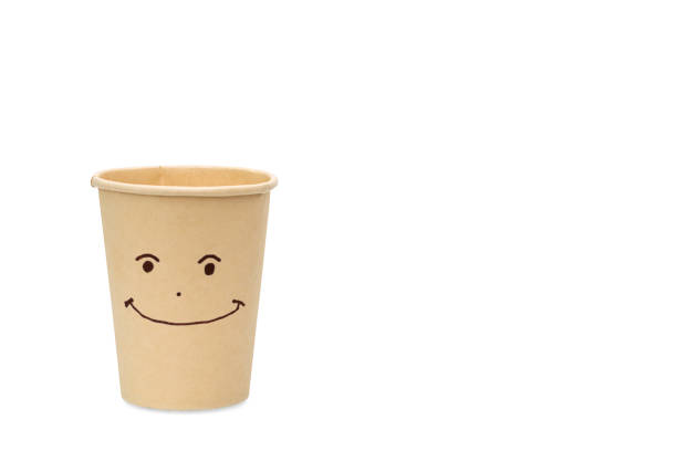 istock happy face on brown paper cup isolated. 1395105132