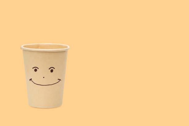 istock happy face on eco paper cup isolated. 1395105226