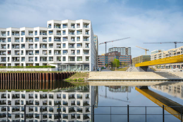 istock new modern residential district under construction in berlin at river side 1395109808