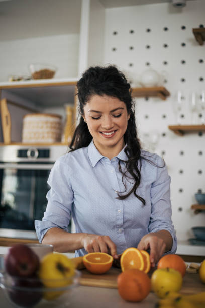 istock Beautiful woman in the kitchen. 1395109831