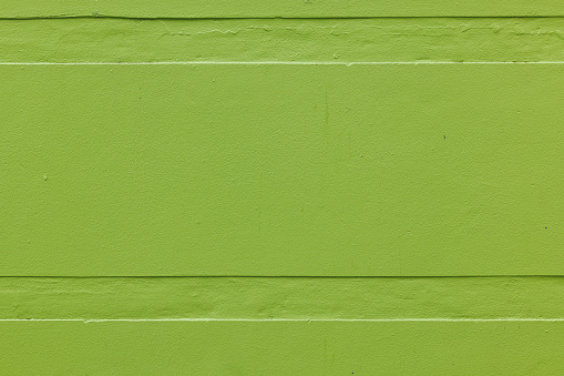 Close-up on a green concrete wall.