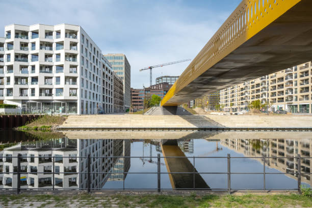 istock new modern residential district under construction in berlin at river side 1395110017