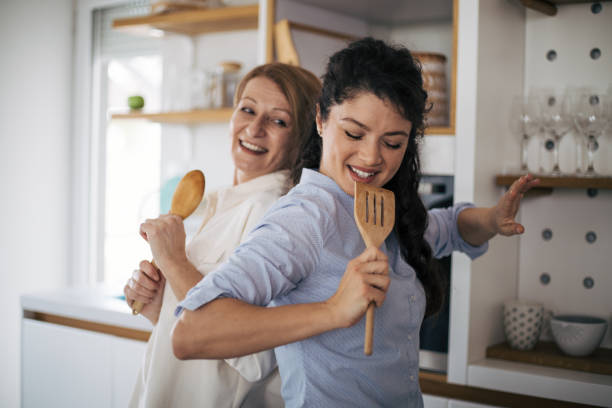 istock Mother and daughter enjoying in the kitchen. 1395110026