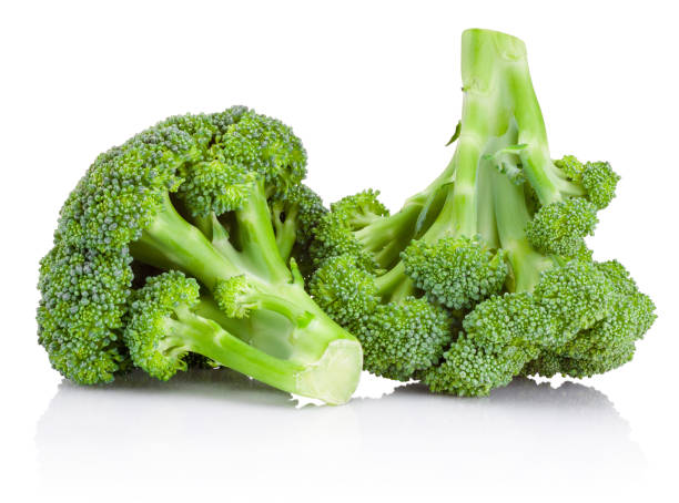 Raw green broccoli isolated on white background Raw green broccoli isolated on a white background brokoli stock pictures, royalty-free photos & images