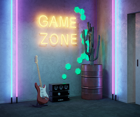 Retro game zone neon light sign. Night view of video gamer room with glowing game zone light, music system, guitar and cactus in a barrel.