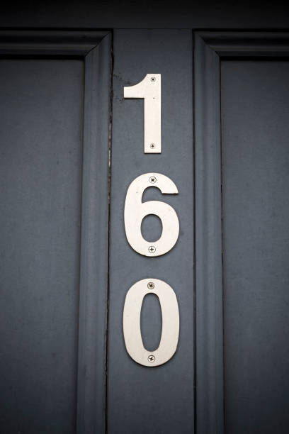 istock Number one hundred and sixty on doorway 1395111791