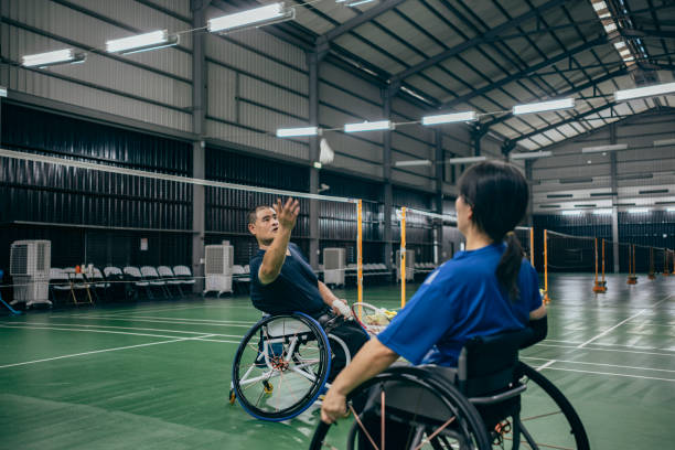 istock Enjoy life - Asian handicapped people training badminton 1395112582