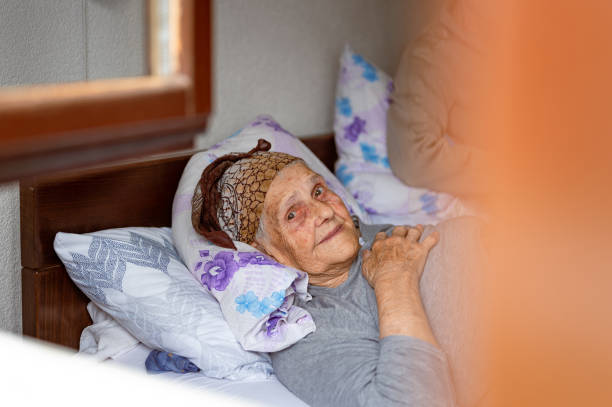 istock Old woman resting in a bed 1395113627