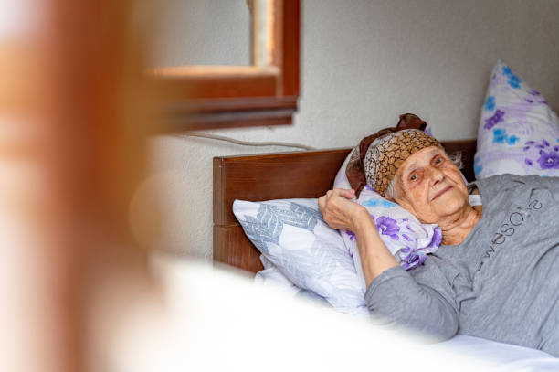 istock Old woman resting in a bed 1395113662