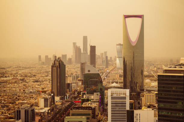 Riyadh urban skyline cityscape View over Riyadh with with dust and sand in the air giving a golden colour riyadh stock pictures, royalty-free photos & images