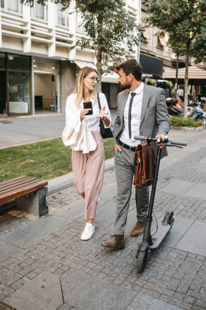istock Business people with electric scooter 1395114561