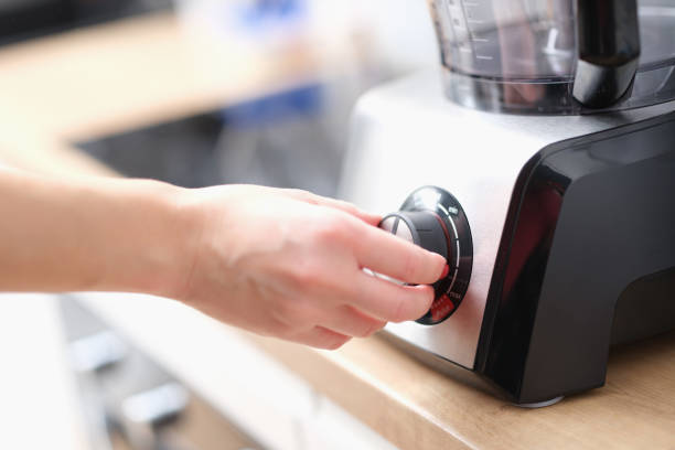 istock Woman using blender to make tasty dish 1395114735