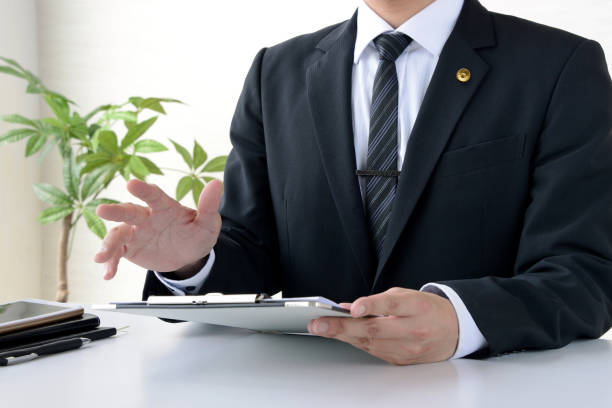 istock Japanese male lawyer working in office 1395115877