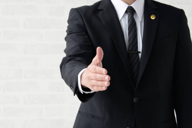 Japanese male lawyer reaching hand forward