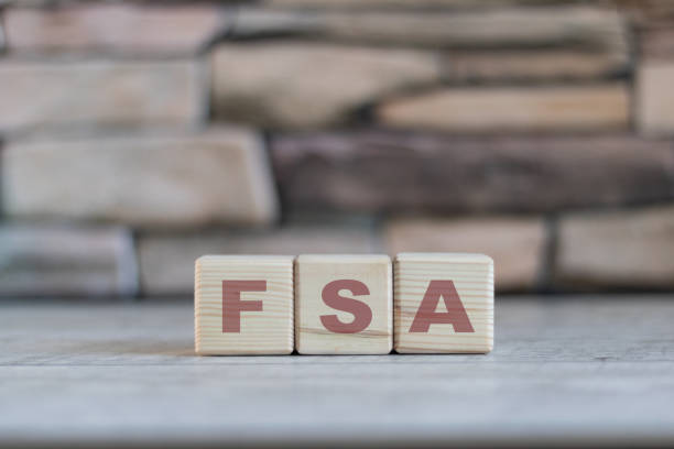 FSA is an abbreviation of wooden blocks with letters on a white background. Selective focus. fsa - short for flexible expense account FSA is an abbreviation of wooden blocks with letters on a white background. Selective focus. fsa - short for flexible expense account free syrian army stock pictures, royalty-free photos & images