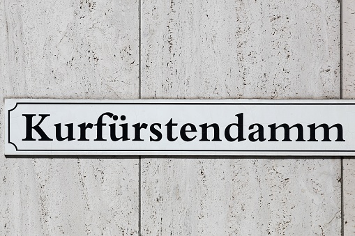 Kurfurstendamm sign on a wall.